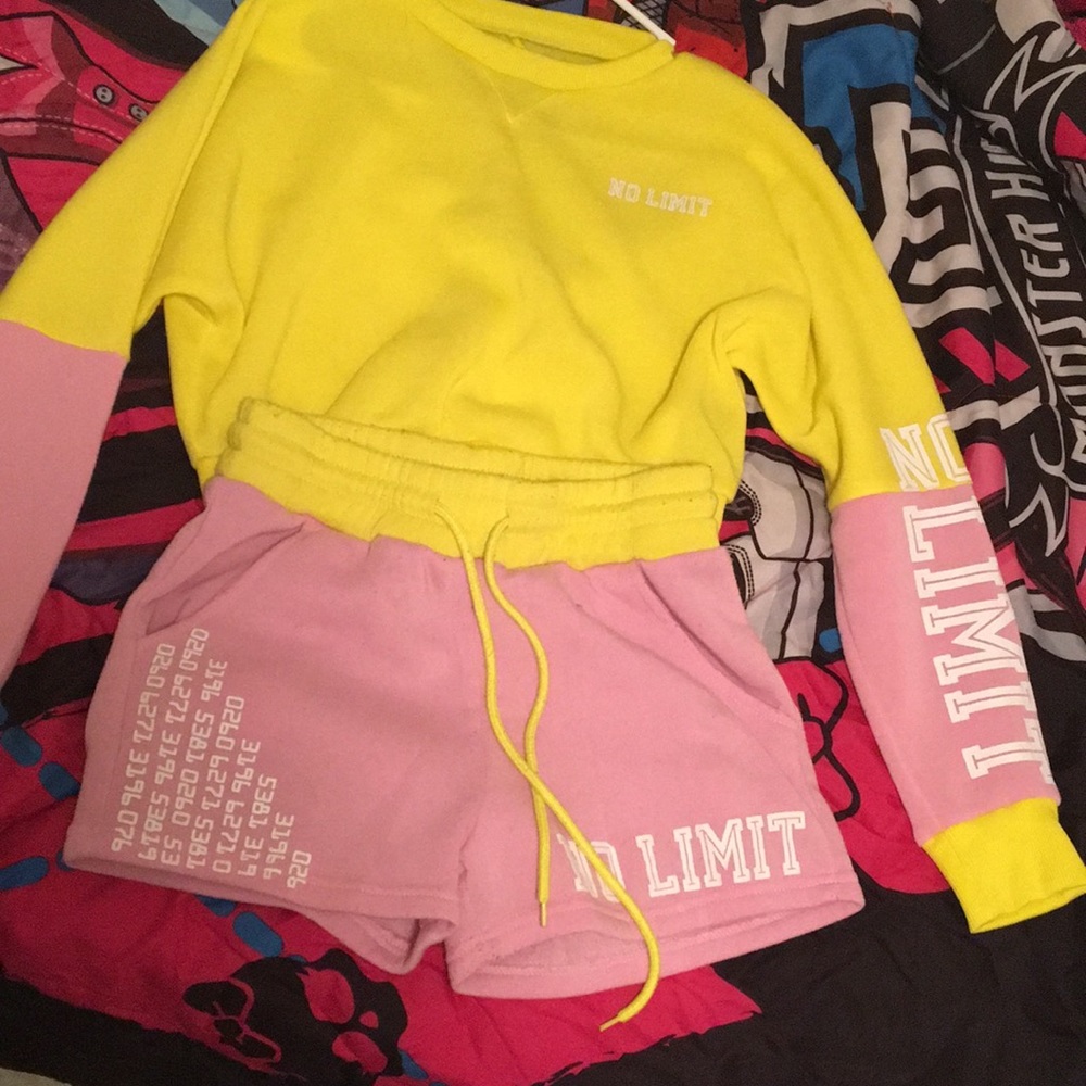 A pink and yellow sweater and shorts set.